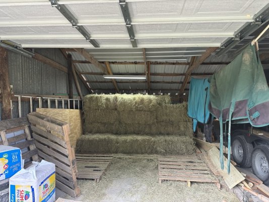 Hay 36 bales stacked.JPG