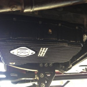 BD Trans pan. Hold 4.5 qts more than stock. Keeps the trans really cool