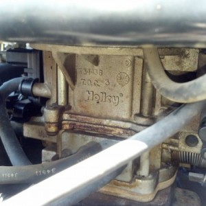 Holley 2bbl carb that definitely needs to either be replaced or rebuilt.