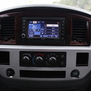 Swap factory radio and bezel with new bezel and nav