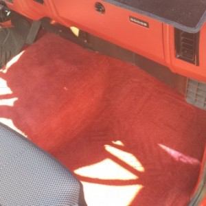 Pulled the floor mat out to show the carpet.