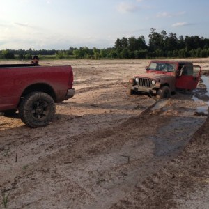 this poor little jeep tried to follow bent his bumper pulling him out
