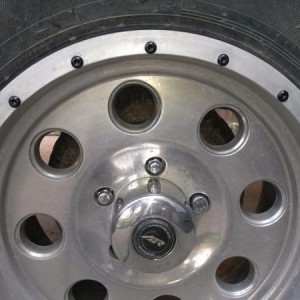 17" American Racing rims , decided to spice em up by removing all the outer trim bolts to paint them black.