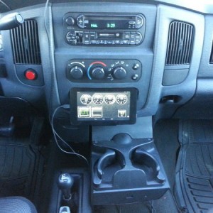 Tablet integrated in the Dash Center Bezel, Cup Holder still opens, and cups don't touch the tablet or obstruct the view.
