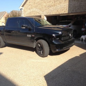 Stock with plasti-dipped factory sport wheels and smoked lights.
