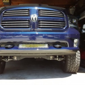 Sanded, primed, and painted the filler piece so it looks much better. Gaps against the light bar hinges are nearly identical. A new filler piece was o
