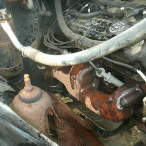 Replacing the cracked manifold. Truck sounded like **** or I would have left it go