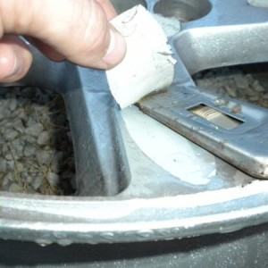 Removing the glue from the rims.