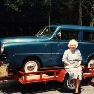 1950 Crosley my mother sitting on trailer, what my dad toyed with.