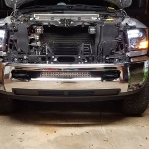 black projector bar style headlights 
cree led cubes behind grille