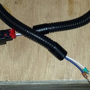 Completed harness wrapped with conduit.