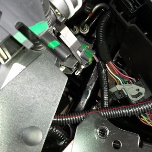 End of the line under the PDC. If you want a more factory look, add about 10 inches of wire between your supplied leads.