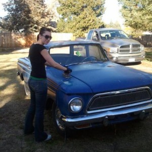Making my wife do some body work on the 63 Rambler with my Ram in the background.
