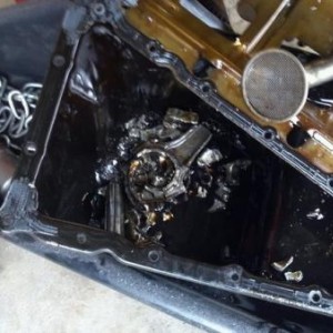 Bottom of the oil pan goodies. Shartered number three piston and rod.