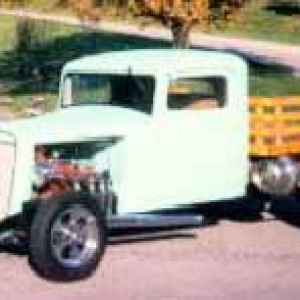 My dad's 1936 International in front of John Deere Glass Palace world headquarters and home in Moline Illinois.