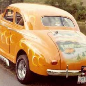 My grandpa's 1941 Chevy coupe ( Orange Blossom Special ). Check out the mural on trunk.