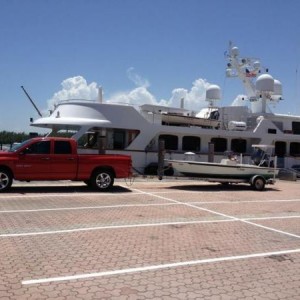 truck and boat with work in the background
