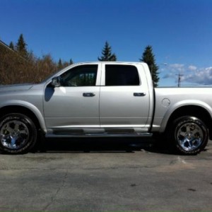 2012 Ram 2. Badges, moldings and black stickers between windows removed. 3.5" leveling kit in front. 1.75" leveling kit in rear.