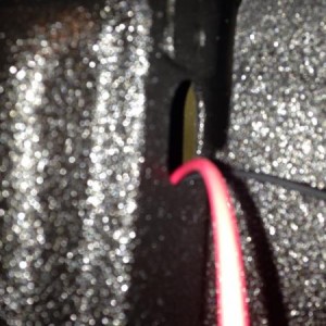 Utilized the hole in the back bed pillar to run power and ground wires under the bed
