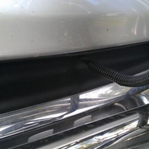 After i installed the bull bar I didn't like the gap it left where the black plastic piece was supposed to be. I cut the black plastic piece to fit ar