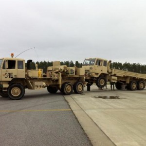 5ton wrecker towing a 5ton FMTV cargo transport