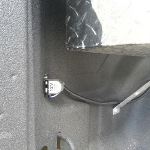 12v outlet in left rear of bed.