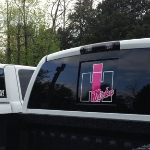My bf's white cummins next to my Hemi with our stickers.