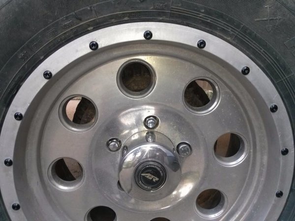 17" American Racing rims , decided to spice em up by removing all the outer trim bolts to paint them black.