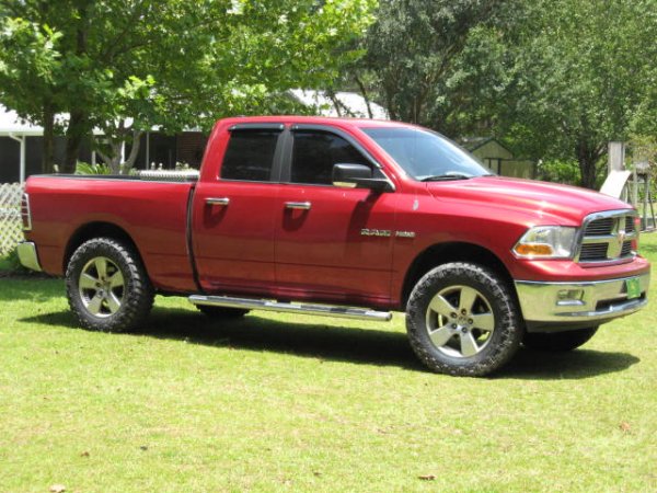 295x65R20, Nitto Trail Grapplers, 2.5" front leveling kit, rear is stock.
