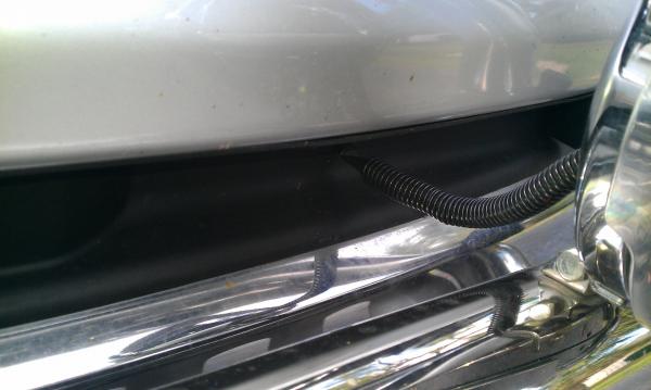 After i installed the bull bar I didn't like the gap it left where the black plastic piece was supposed to be. I cut the black plastic piece to fit ar