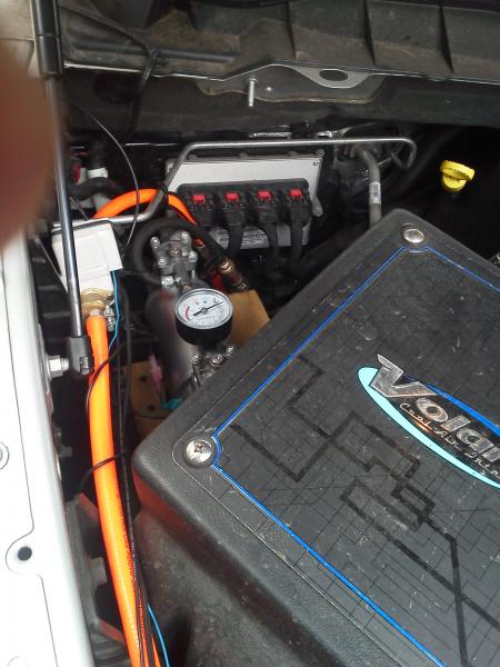 Air Compressor w/ 70psi on/100 psi off auto switch in background, and electric air valve to the left.

Volant CAI in foreground.