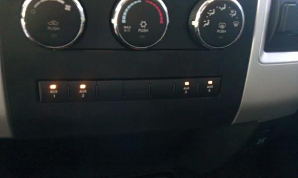 Auxiliary panel installed. 1 turns on work lights on headache rack, 2 turns on remote spotlights and driving lights, 3 turns on my cell phone amplifie