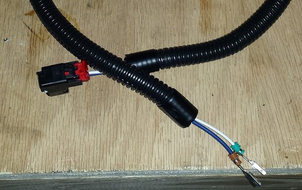 Completed harness wrapped with conduit.