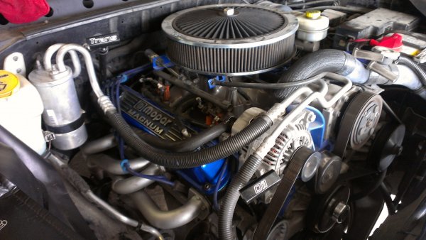 Dirty engine compartment after installing mid-length mopar headers.