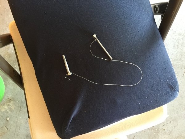Fishing line with improvised handles to remove badges.