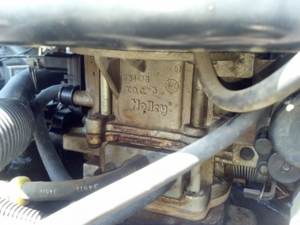 Holley 2bbl carb that definitely needs to either be replaced or rebuilt.