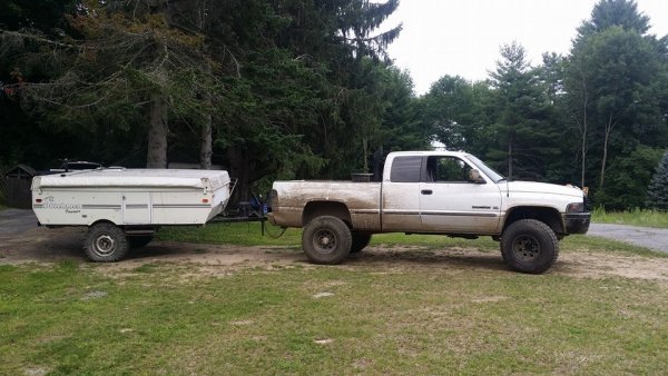 I miss the hell out of this pop-up camper. 6'' lift on 33x10.50 thornbirds and 8 lug dodge wheels.