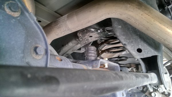 McGaughy's 2/4 drop rear view. Coils and stock bump stop holder cut off and the McGaughy's bump stops installed
