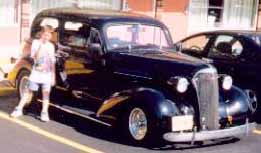 Me with dad's 1937 Chevy in Branson Missouri for the Cruisin Branson Lights carshow when I was Little.