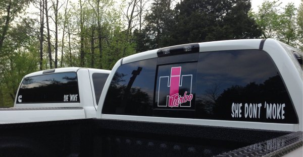 My bf's white cummins next to my Hemi with our stickers.