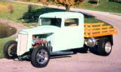 My dad's 1936 International in front of John Deere Glass Palace world headquarters and home in Moline Illinois.