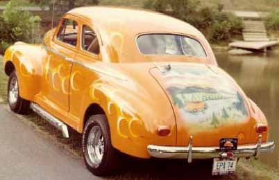 My grandpa's 1941 Chevy coupe ( Orange Blossom Special ). Check out the mural on trunk.