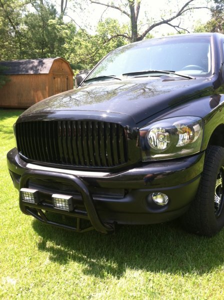New black head lights, New bull bar, New grill, and Plastic dipped bumper.