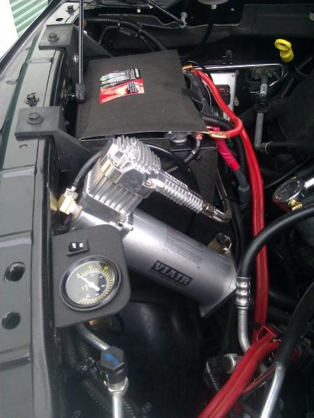 Pressure gauge with secondary switch. Viair compressor. Second battery. The red cables have a quick connect on the end for either jumper cables or my