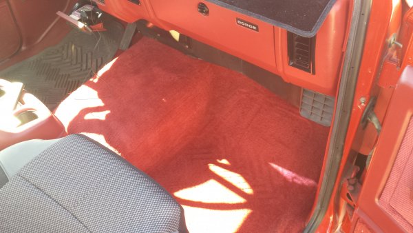 Pulled the floor mat out to show the carpet.
