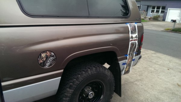 Putting on my rear quarter panels, measured each side and marked to stay in line, while applying the graphic while also here and there using a heatgun