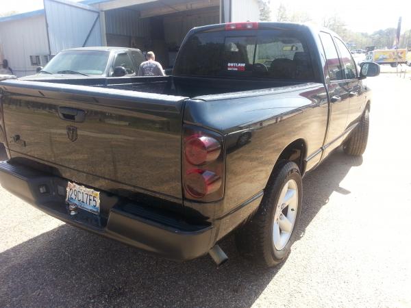 rear bumper blacked out, bighorn logo and ram logo blacked out