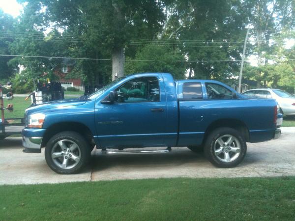 Side shot, my dad's 06 Ram 5.7L Hemi in the background (yep, same color.)