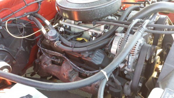 Still has the factory spark plugs and wires, sadly the plugs will have to be changed soon.
