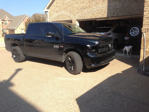 Stock with plasti-dipped factory sport wheels and smoked lights.